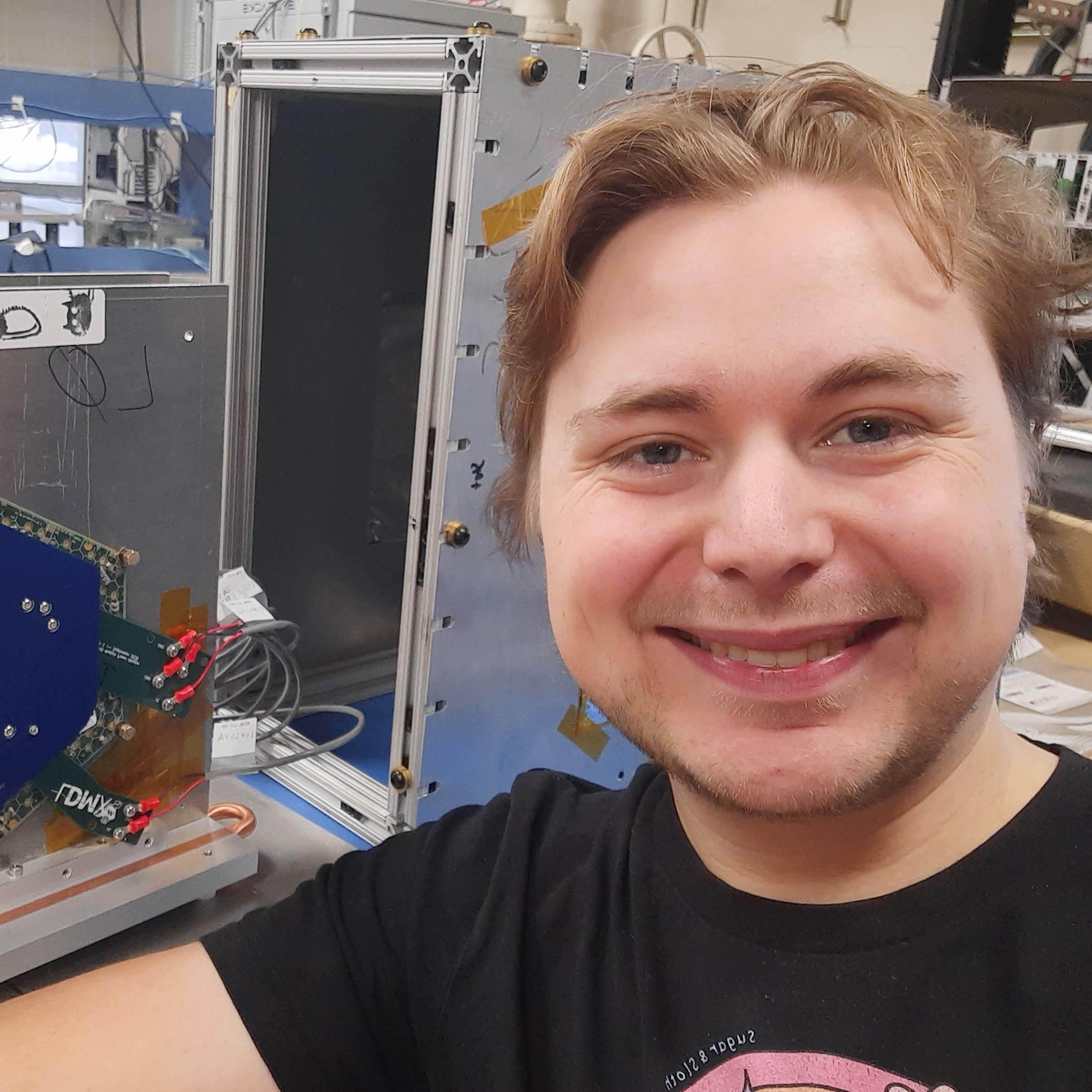 picture white man (Tom) smiling and looking into the camera